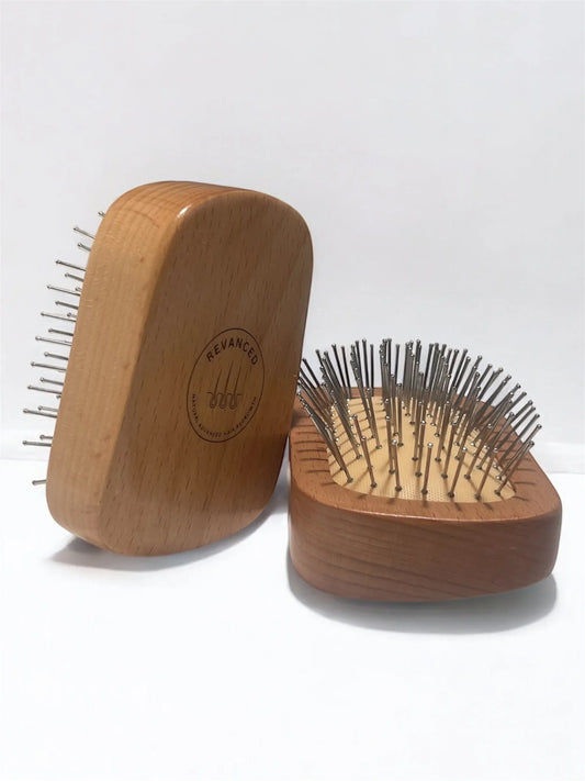 Revanced Wooden hairbrushes with metal bristles on a white background